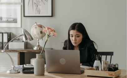 Specialist optimizing bids on laptop